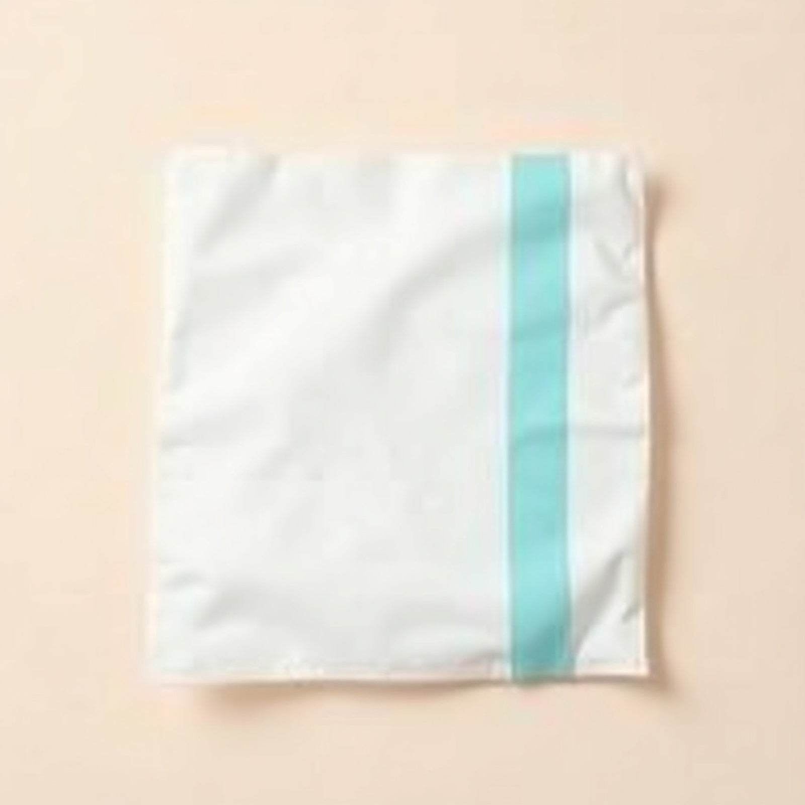 ChillBro Towel XL large single-use cooling sheet unfolded with cyan band